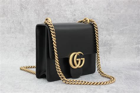 gucci black purse with gold chain|handbag with gold chain strap.